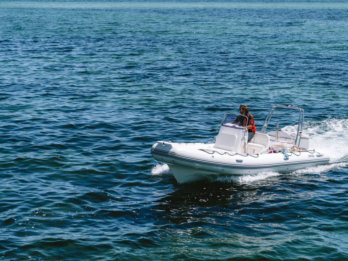 A crew member heading out on a RIB to respond quickly