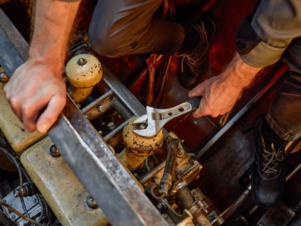 A technician repairing a yacht engine